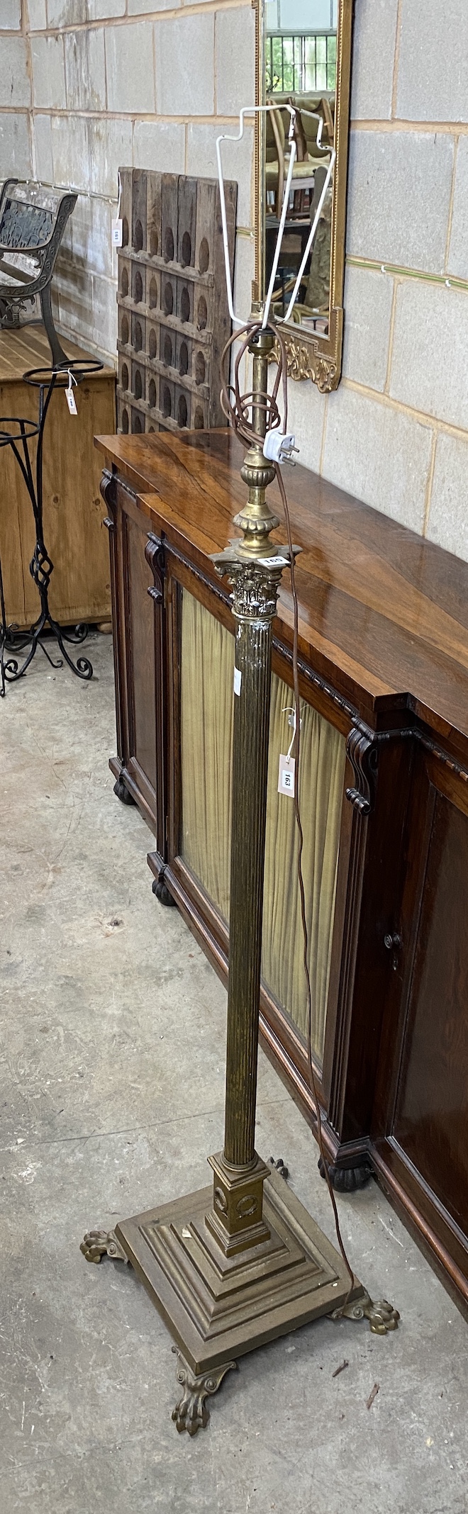 An Edwardian brass Corinthian column telescopic lamp standard